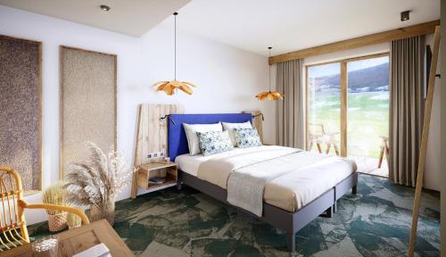Aillon-le-JeuneAuberge d'Aillon et d'Ailleurs的一间卧室配有一张蓝色床头板的床