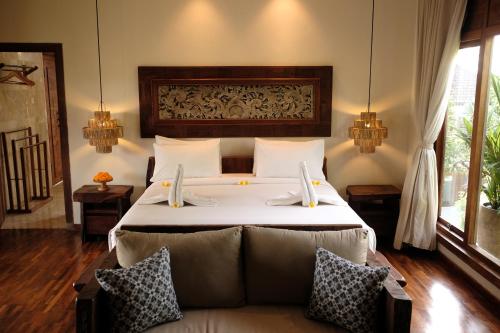Sri Ratih Cottages, CHSE Certified客房内的一张或多张床位