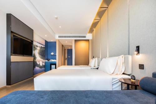 南昌红谷滩铜锣湾广场亚朵酒店客房内的一张或多张床位
