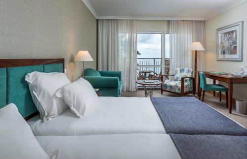 Pestana Grand Ocean Resort Hotel客房内的一张或多张床位
