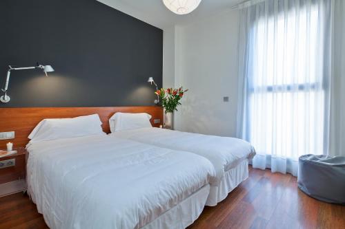 梅尔卡特巴塞罗那市内公寓客房内的一张或多张床位