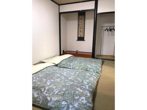 熊本Family House - Vacation STAY 53010v的卧室配有一张床