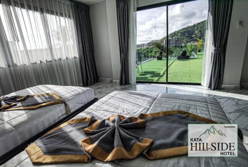 Kata Hillside Hotel客房内的一张或多张床位