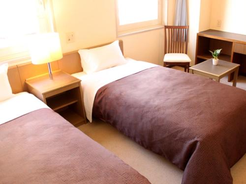 HOTEL LiVEMAX BUDGET Tokyo Kiba客房内的一张或多张床位