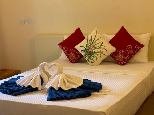 Thoddoo Retreat Grand客房内的一张或多张床位