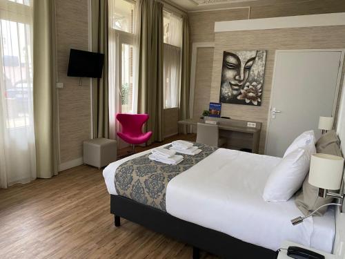 Hotel Andante aan Zee客房内的一张或多张床位