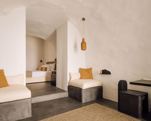 White Exclusive Suites & Villas客房内的一张或多张床位