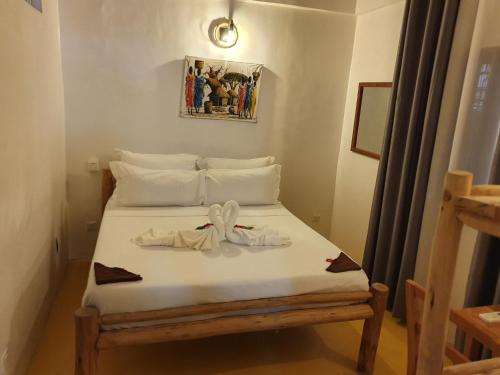 Jambiani Guest Lodge LITHAM客房内的一张或多张床位