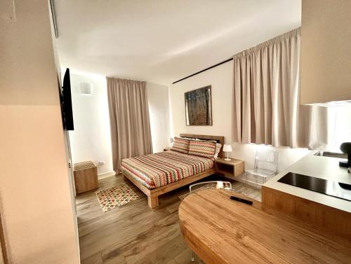 Vespasiani SUITES & APARTMENTS客房内的一张或多张床位