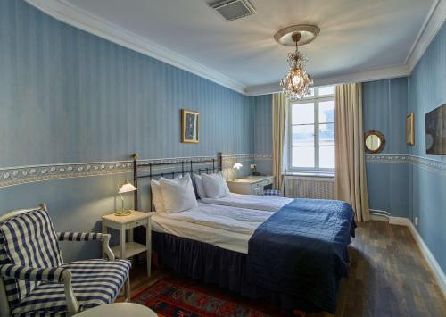 斯堪迪克格姆拉斯坦酒店客房内的一张或多张床位