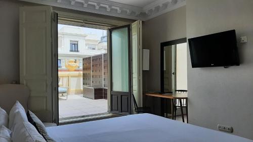 马德里萨尔第耐罗酒店客房内的一张或多张床位