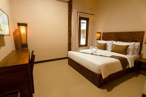 Syailendra Hotel Syariah客房内的一张或多张床位