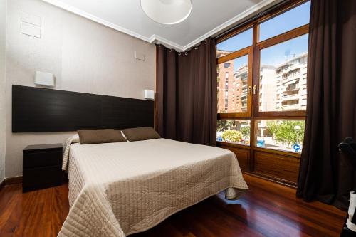 Alojamiento Catamarán客房内的一张或多张床位