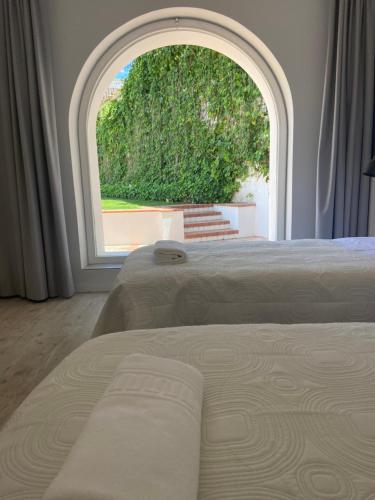 Casa Pitta Charm Villa客房内的一张或多张床位