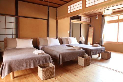 Temari Inn Oitoma客房内的一张或多张床位