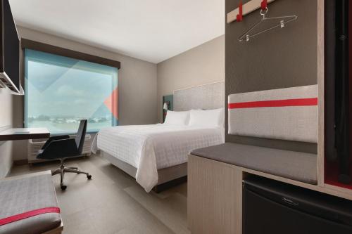 avid hotels - Melbourne - Viera, an IHG Hotel客房内的一张或多张床位