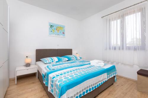 Apartments Otia Seaview客房内的一张或多张床位