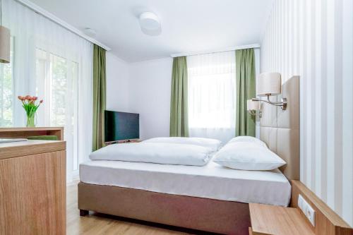 Landhaus Bad Gleichenberg客房内的一张或多张床位
