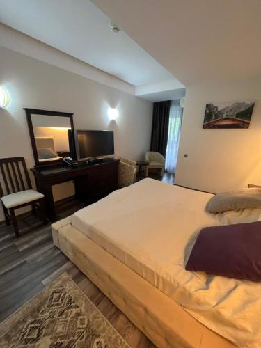 Alpin Resort Apartments Deluxe 2406客房内的一张或多张床位