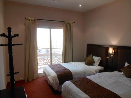 Samaya Al Khobar Hotel Apartments客房内的一张或多张床位