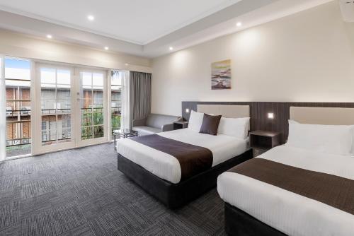 墨尔本机场品质酒店客房内的一张或多张床位