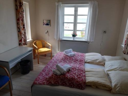 Det Gamle Hotel Rudkøbing客房内的一张或多张床位