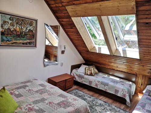 Mini Kotedžas Vakaris客房内的一张或多张床位