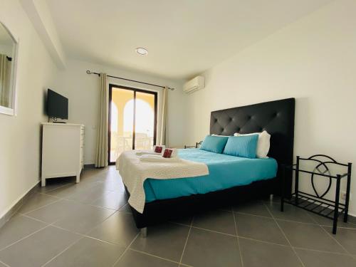 Apartamentos Poente da Aldeia客房内的一张或多张床位