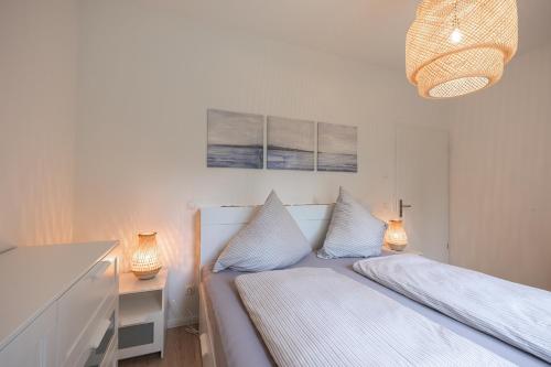 Wohnen am Südstrand - Ferienwohnung 1 5客房内的一张或多张床位