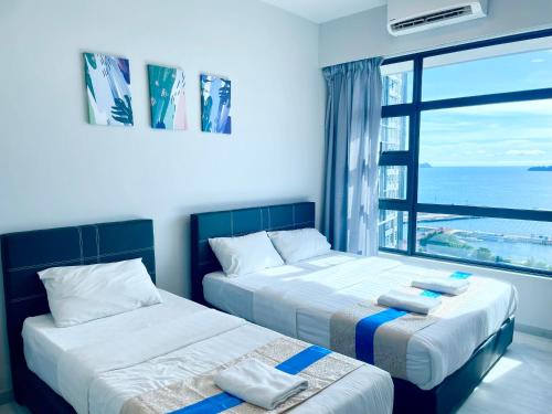 Sunset Seaview Vacation Condos @ Jesselton Quay客房内的一张或多张床位