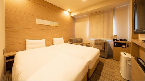 Via Inn Higashiginza客房内的一张或多张床位