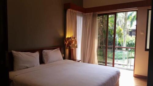 Garden View Pulai Springs Resort客房内的一张或多张床位