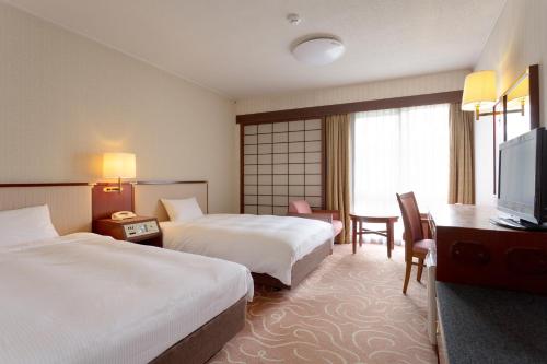 Art Hotel Narita客房内的一张或多张床位