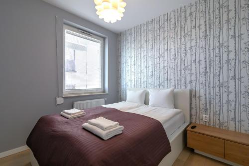 Apartament Muszelka Jantar TriApart客房内的一张或多张床位