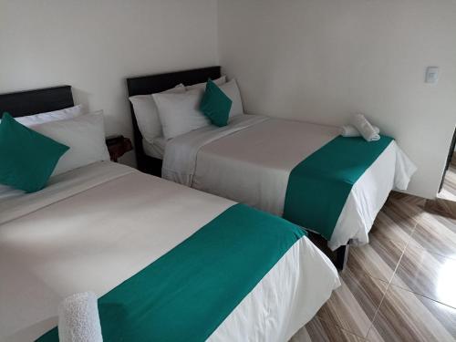 Hotel SAMAI客房内的一张或多张床位