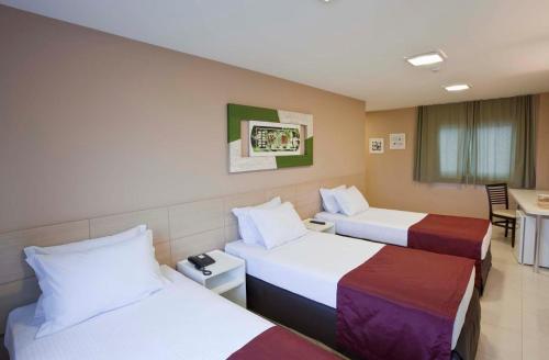格兰德伊塔瓜伊酒店客房内的一张或多张床位
