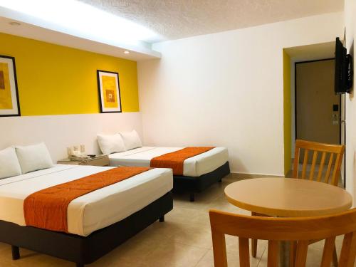 切图马尔椰子酒店客房内的一张或多张床位