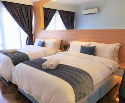 北欧ING风格豪华日出海景套房 Nordic ING Luxury Seaview Suite客房内的一张或多张床位