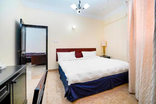 OYO 124 Al Salam Palace Hotel客房内的一张或多张床位
