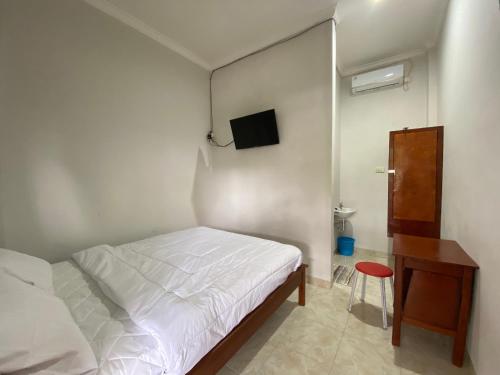 OYO 91419 Hotel Mulia Bangka客房内的一张或多张床位