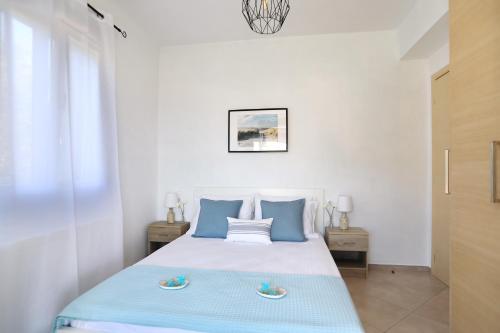 Esperides Apartments Aigli客房内的一张或多张床位
