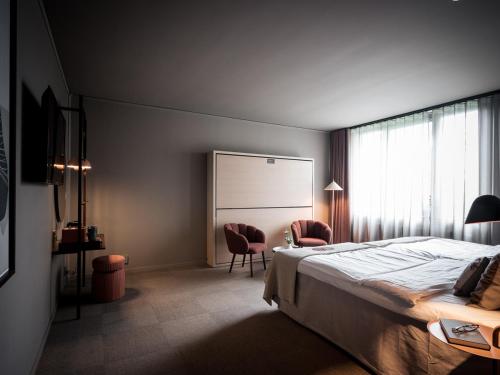 马略纳斯巴尔酒店客房内的一张或多张床位