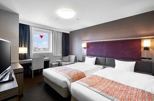 札幌薄野大和鲁内酒店客房内的一张或多张床位