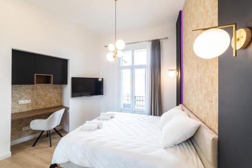 Monaco frontière - Appartement Luxe - Belle Epoque - AD客房内的一张或多张床位