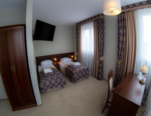 帝国公寓酒店客房内的一张或多张床位