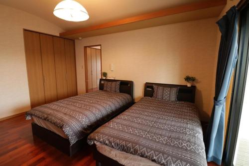 Ugana Villa Ginowan - Vacation STAY 13237客房内的一张或多张床位