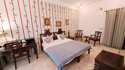 摩哂陀普拉喀什酒店客房内的一张或多张床位