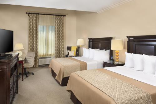 奥兰治艾尔斯酒店客房内的一张或多张床位