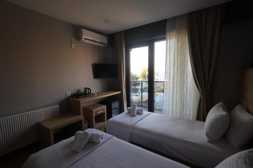 Taşliman Otel客房内的一张或多张床位