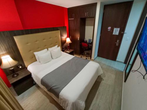 Hotel HR Cúcuta客房内的一张或多张床位